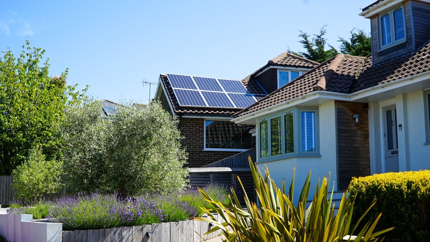 Detail of solar panels mounted on a finished shingle roof
